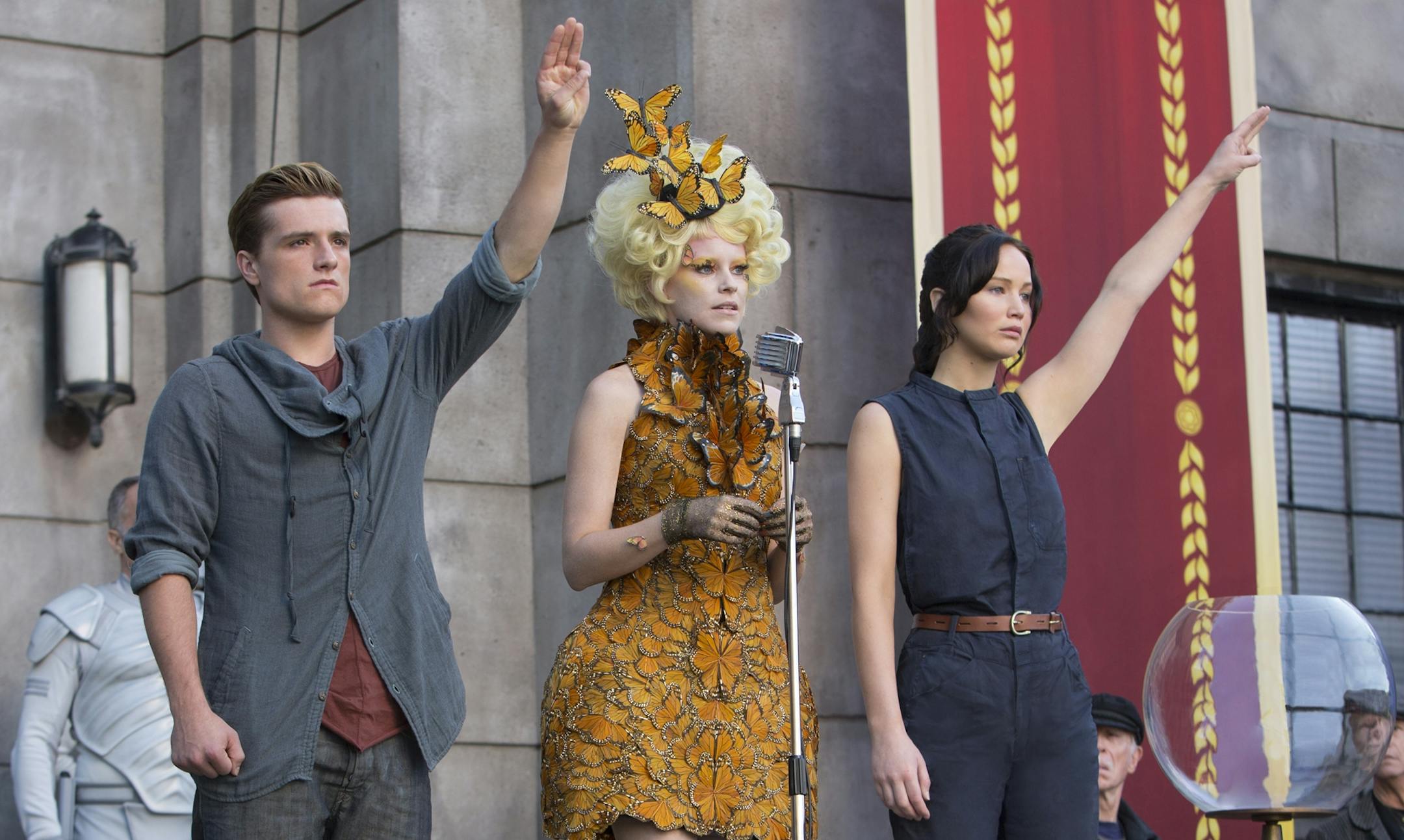 This image released by Lionsgate shows Josh Hutcherson as Peeta Mellark, from left, Elizabeth Banks as Effie Trinket and Jennifer Lawrence as Katniss Everdeen in a scene from "The Hunger Games: Catching Fire." (AP Photo/Lionsgate, Murray Close)