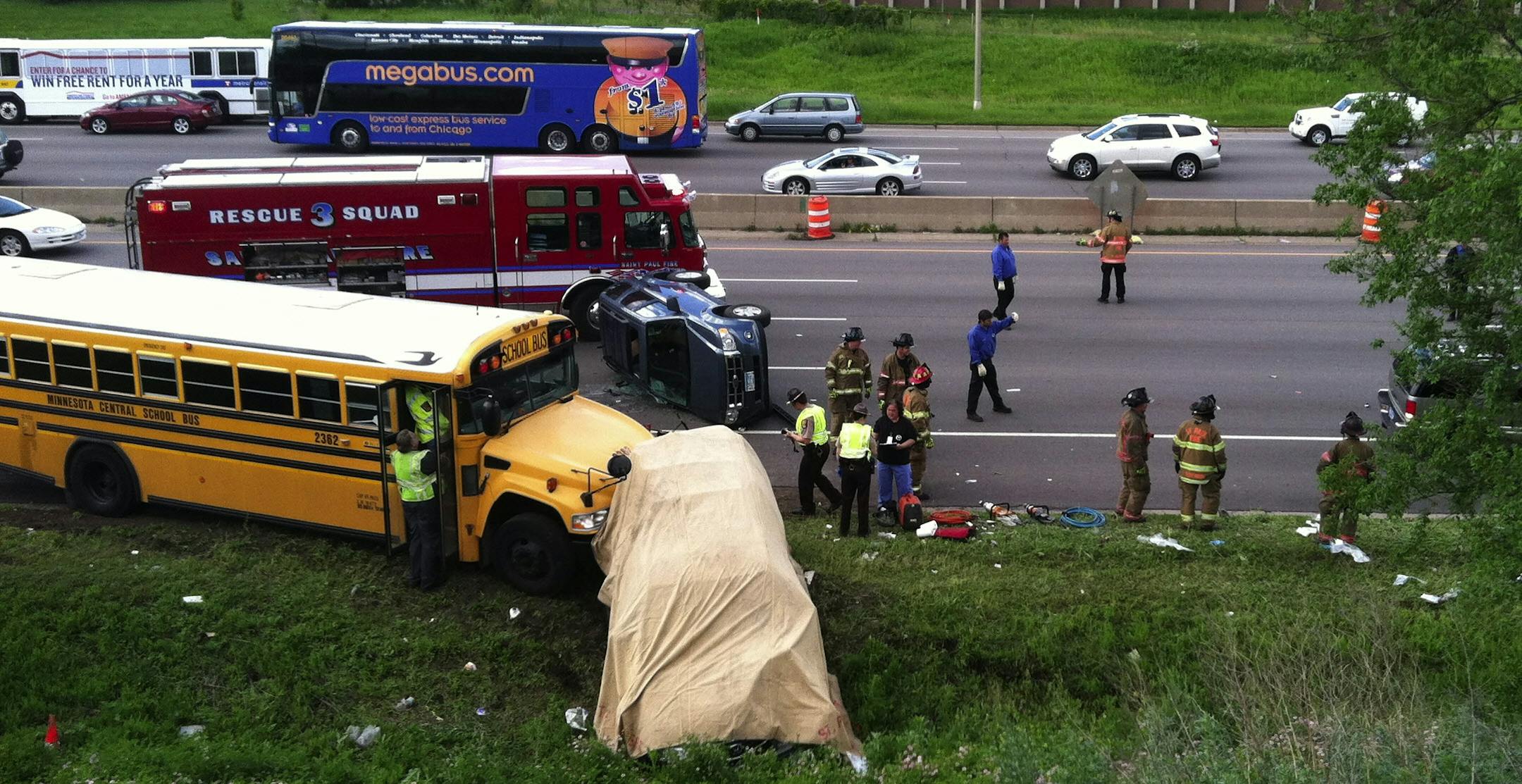 DAVID JOLES/STAR TRIBUNE. MAY 30, 2012. A school bus and a passenger vehicle crashed Wednesday morning along I-94 in St. Paul, and authorities are confirming that at least one person is dead.