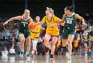 Gophers forward Mallory Heyer was pressured by Michigan State guards Tory Ozment (1) and Moira Joiner (22) in the third quarter Saturday.
