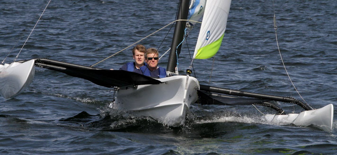 BRUCE BISPING &#x2022; bbisping@startribune.com Minneapolis, MN., Wednesday, 5/4/11] (left to right) Robert Sanberg and Dean Sanberg, of WindRider International, tested one of their 17 foot trimaran sailboats on Lake Calhoun. The father-son team aquired the almost dormant company, that was facing closing, and moved production from Pine City to Minneapolis.