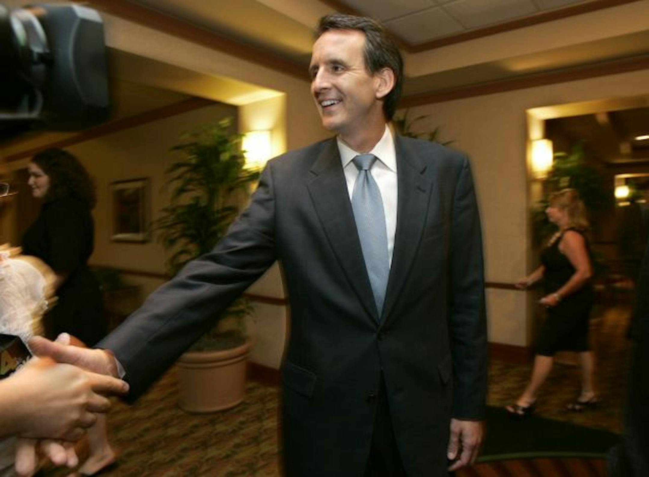 Minnesota Gov. Tim Pawlenty greets reporters before speaking at a Republican Party of Arkansas fund raising dinner in Little Rock, Ark., Friday, June 26, 2009.