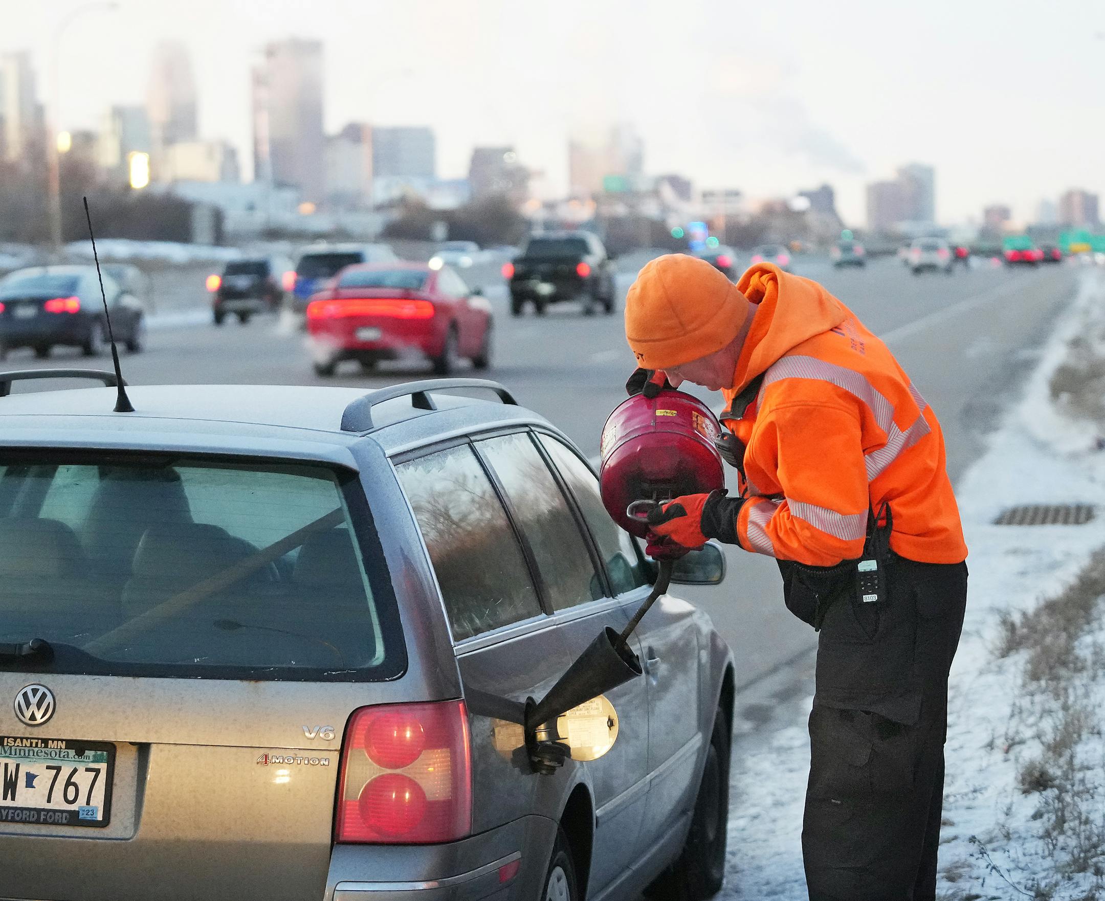 Mike Ahlman, a driver for MnDOT's Freeway Incident Response Safety Team, put 2 gallons of gas into the vehicle of a motorist who ran out of gas on Interstate 94 on the city's north side.