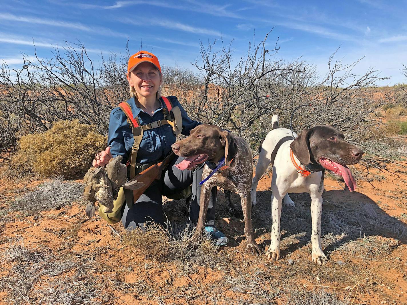 New Pheasants Forever CEO Marilyn Vetter, 55, is an avid upland bird hunter. She's shown here in Arizona with her German shorthairs while hunting Mearns quail.