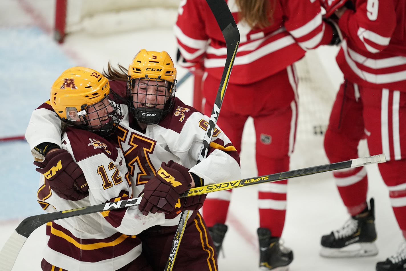 Gophers forward Grace Zumwinkle was mobbed by Taylor Heise (9) after she scored the Gophers third goal of the game in the third period.