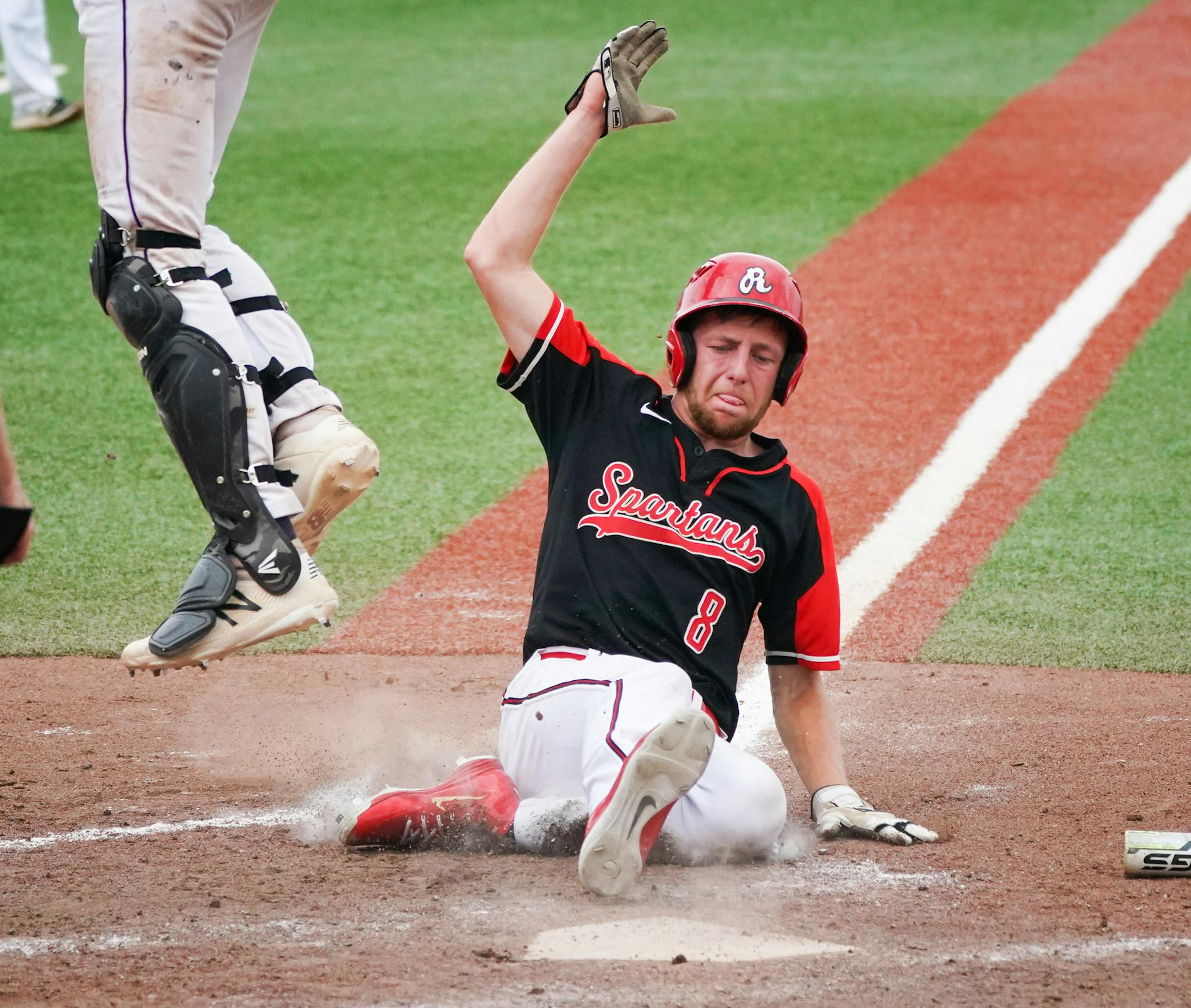 Rocori's Brock Leither (8) scored Rocori's final run in the the fifth inning against New Ulm. ] GLEN STUBBE • glen.stubbe@startribune.com Friday, June 15, 2018 Class 3A baseball state semifinal game action where Rocori beat New Ulm 5-0.