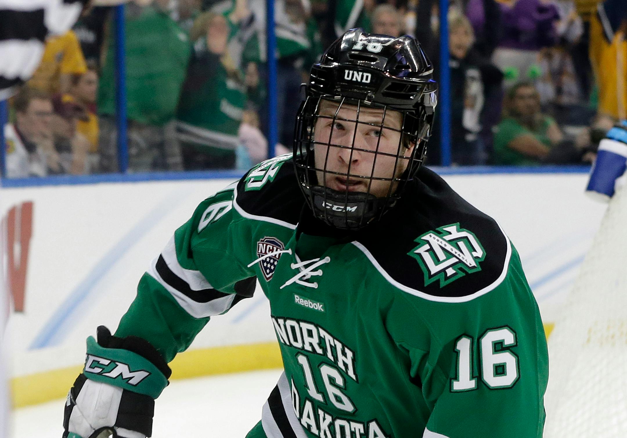 North Dakota forward Brock Boeser (16) celebrates his shorthanded goal against Quinnipiac during the first period of an NCAA Frozen Four championship college hockey game Saturday, April 9, 2016, in Tampa, Fla.