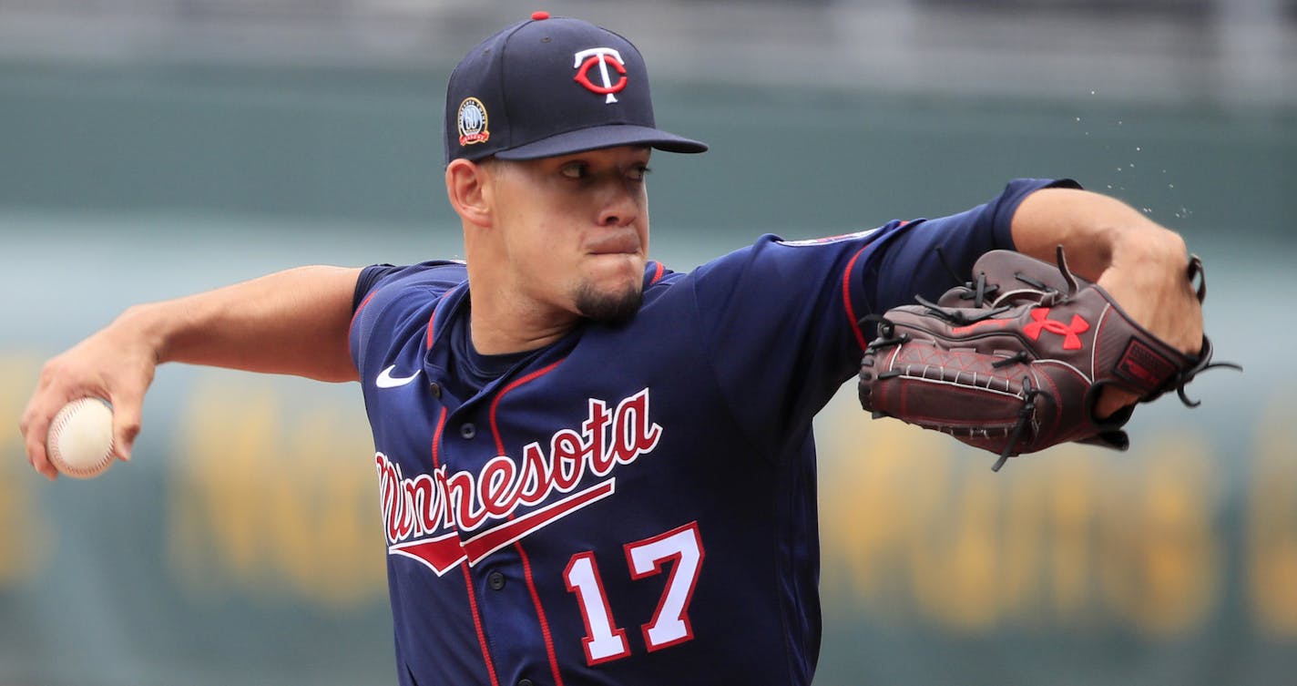 Minnesota Twins starting pitcher Jose Berrios delivers to a Kansas City Royals batter during the first inning of a baseball game at Kauffman Stadium in Kansas City, Mo., Sunday, Aug. 9, 2020. (AP Photo/Orlin Wagner)