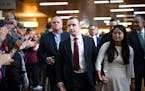 Minnesota state trooper Ryan Londregan is greeted by supporters as he arrives with his wife, Grace, and his legal team Monday, April 29, 2024, at the 