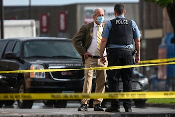 Lt. Richard Zimmerman, the head of the Minneapolis Police Department’s homicide unit, spoke to a sergeant at the scene of a shooting on Washington A