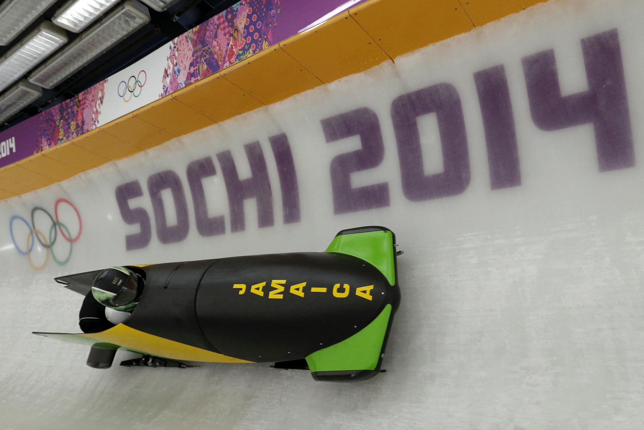 The JAM-1 sled from Jamaica, takes a turn during a training run for the men's two-man bobsled at the 2014 Winter Olympics, Thursday, Feb. 6, 2014, in Krasnaya Polyana, Russia. (AP Photo/Michael Sohn)