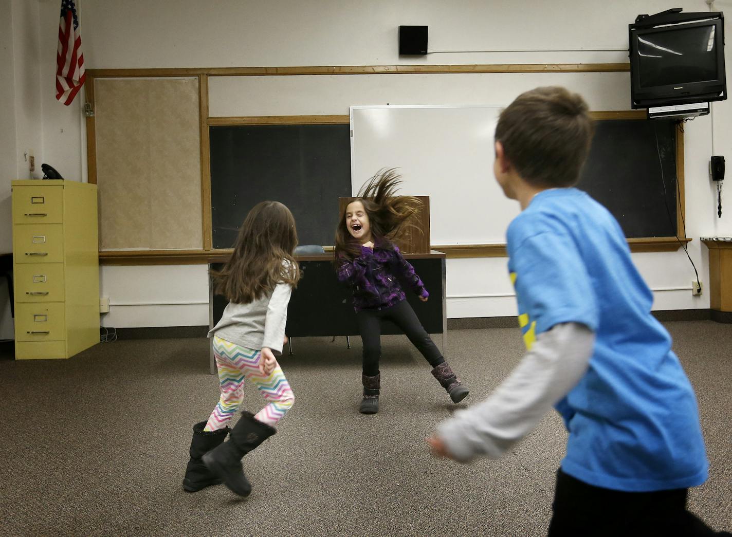 Brianna Schwartzberg, 7, Amria David, 7, and Benji Brown, 6, played in an empty classroom during a tour of the new Agamim Academy in Hopkins, Minn. ] CARLOS GONZALEZ cgonzalez@startribune.com, January 13, 2015, Hopkins, Minn., Feature on Agamim, the country's first Hebrew school to be taught via Classical Instruction, a specific teaching approach used at some charter schools. The school will open next fall in Hopkins and already has about 153 prospective students. On 1/13, families will be able