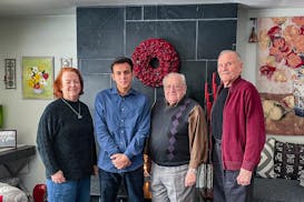 Eileen Monaghan, left, Mohammad Agha Mohammadi, Brian Whitfield and Gerard Monaghan gathered in the Monaghans’ living room in New Milford, Conn. The