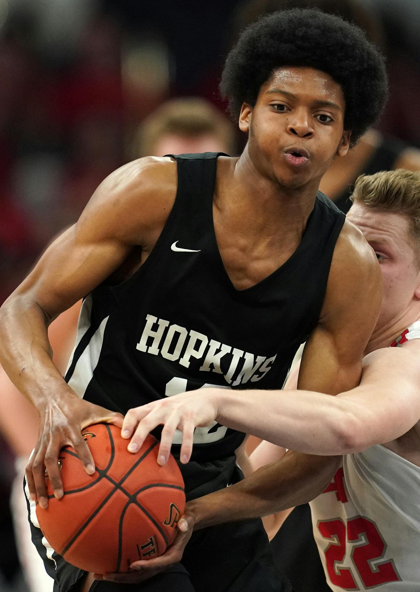 Lakeville North guard Tommy Jensen (22) tried to swat the ball away from Hopkins guard Kerwin Walton (12) in the first half. ] ANTHONY SOUFFLE &#x2022; anthony.souffle@startribune.com Lakeville North High School played Hopkins High School in MSHSL Class 4A boys' basketball championship game Saturday, March 23, 2019 at the Target Center in Minneapolis.