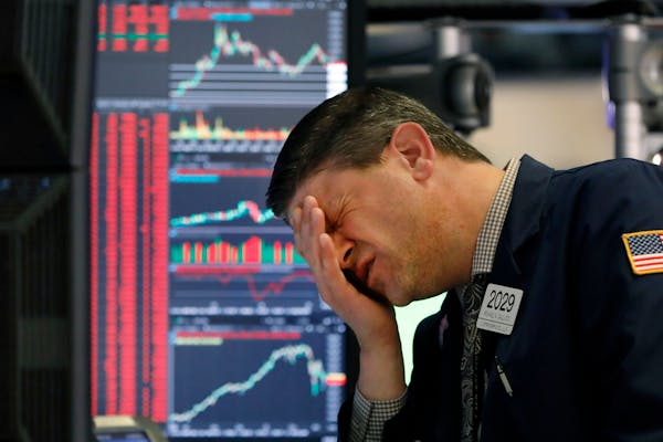 Trader Michael Gallucci works at his post on the floor of the New York Stock Exchange, Wednesday, March 11, 2020.