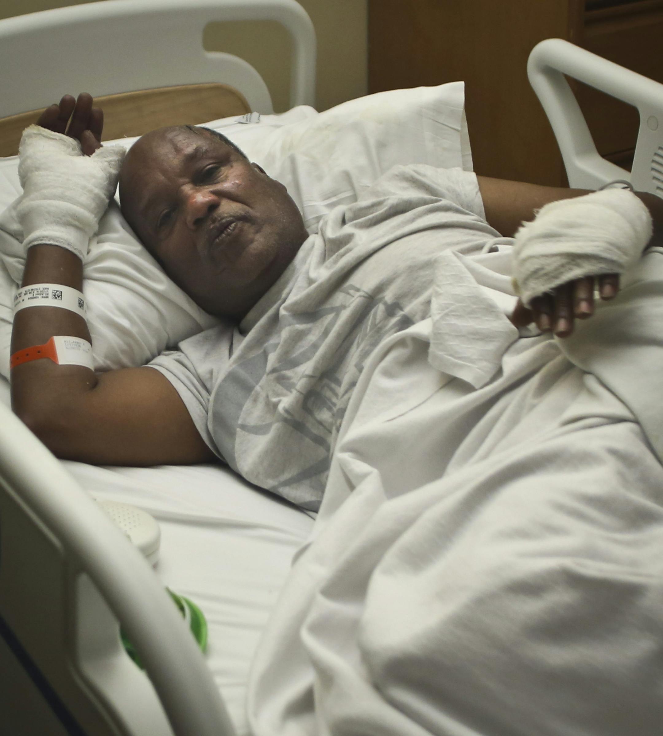 Adani Ali was bandaged in his hands after he escaped the fire in his apartment complex on Cedar Avenue in Minneapolis, Minn., on Wednesday, January 1, 2014. ] RENEE JONES SCHNEIDER ‚Ä¢ reneejones@startribune.com