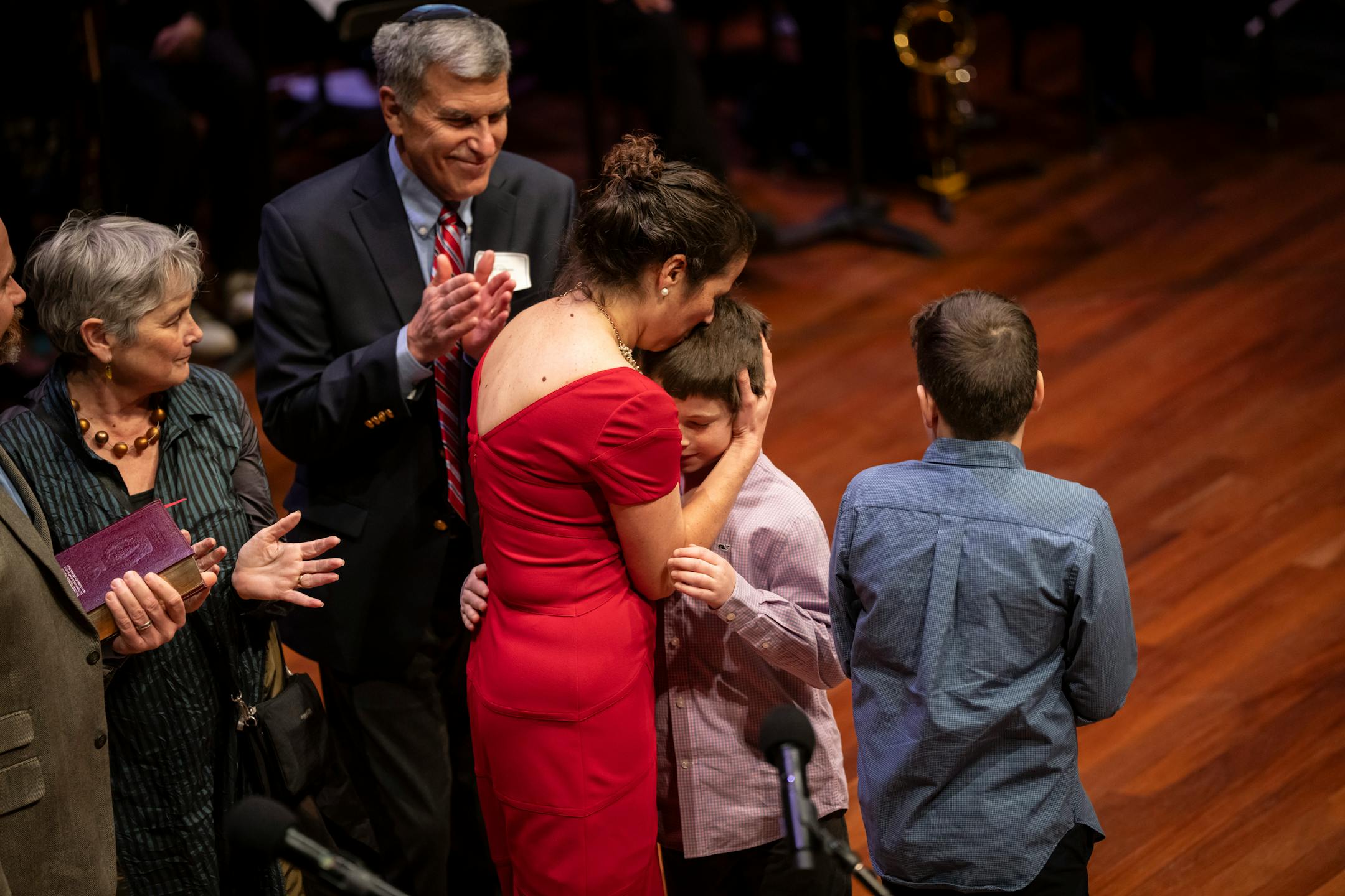 Council Member Rebecca Noecker, Ward 2, embraces her son after being sworn in at the swearing in ceremony of the seven female St. Paul city council members, four new to the council, at the Ordway Center on Tuesday, Jan. 9, 2024 in St. Paul, Minn. ] RENEE JONES SCHNEIDER • renee.jones@startribune.com