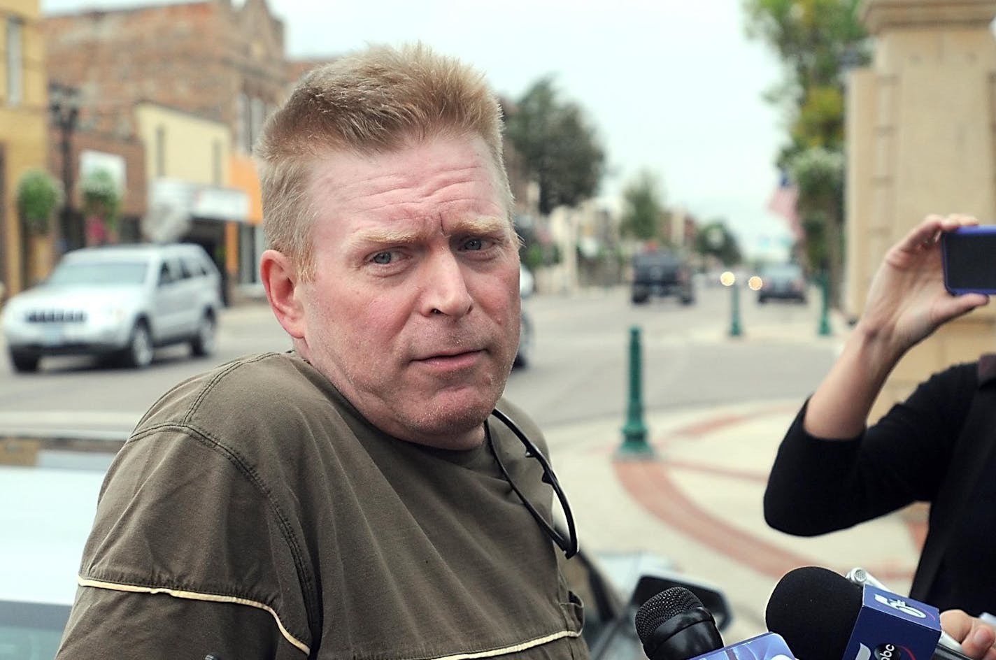 David LaDue, father of John LaDue, speaks to reporters outside the Waseca County Courthouse after his son's plea hearing, Friday, Sept. 18, 2015, in Waseca, Minn. John LaDue pleaded guilty to one count of possessing an explosive device. As part of a plea agreement, the 18-year-old will be sent to a secure treatment facility for autism spectrum disorder patients. He'll then go to a halfway house. Five other counts will be dismissed. (Pat Christman/The Free Press via AP) MANDATORY CREDIT