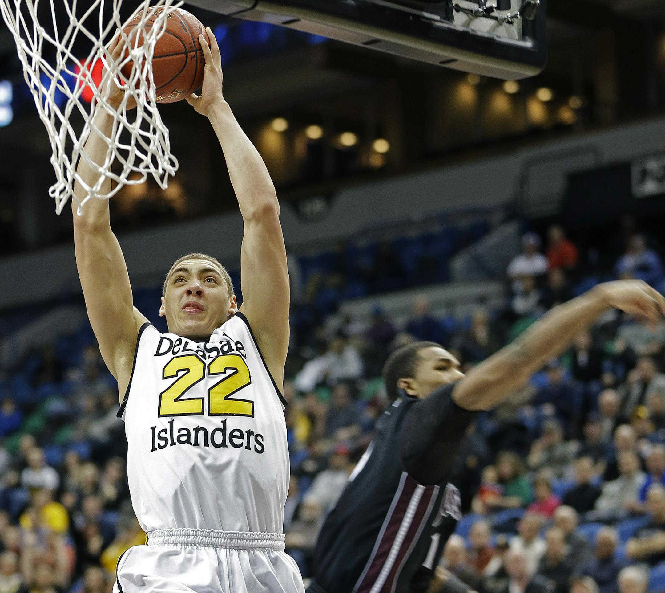 DeLaSalle's Reid Travis dunked the ball during the first half of the boys' basketball Class 3A semifinals at the Target Center, Thursday, March 21, 2013 in Minneapolis, MN. (ELIZABETH FLORES/STAR TRIBUNE) ELIZABETH FLORES • eflores@startribune.com ORG XMIT: MIN1303211322402909