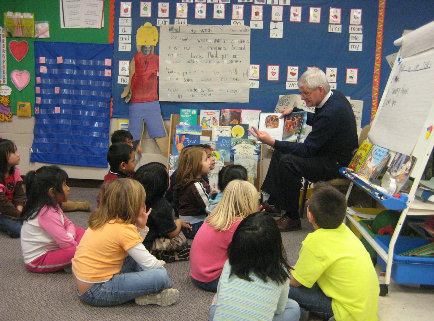 PHOTO COURTESY OF SHAKOPEE SCHOOL DISTRICT ... Shakopee Superintendent Jon McBroom reading to Jennifer Kostka's kindergarten class at Pearson Elementary School on Feb. 2, 2009. He read one of his favorite books, "One Winter's Day" by M. Christina Butler and Tina Macnaughton, to kick off to the school's month of guest readers in celebration of "I Love To Read" Month.