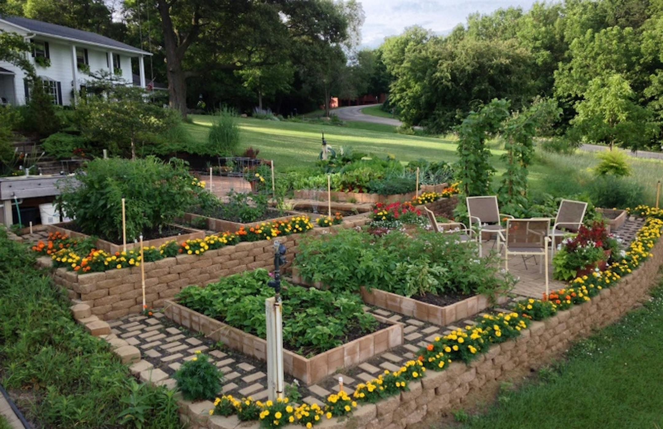 The Dubas added raised beds for growing vegetables. Their acreage includes sweeping views of the Cannon River Valley.