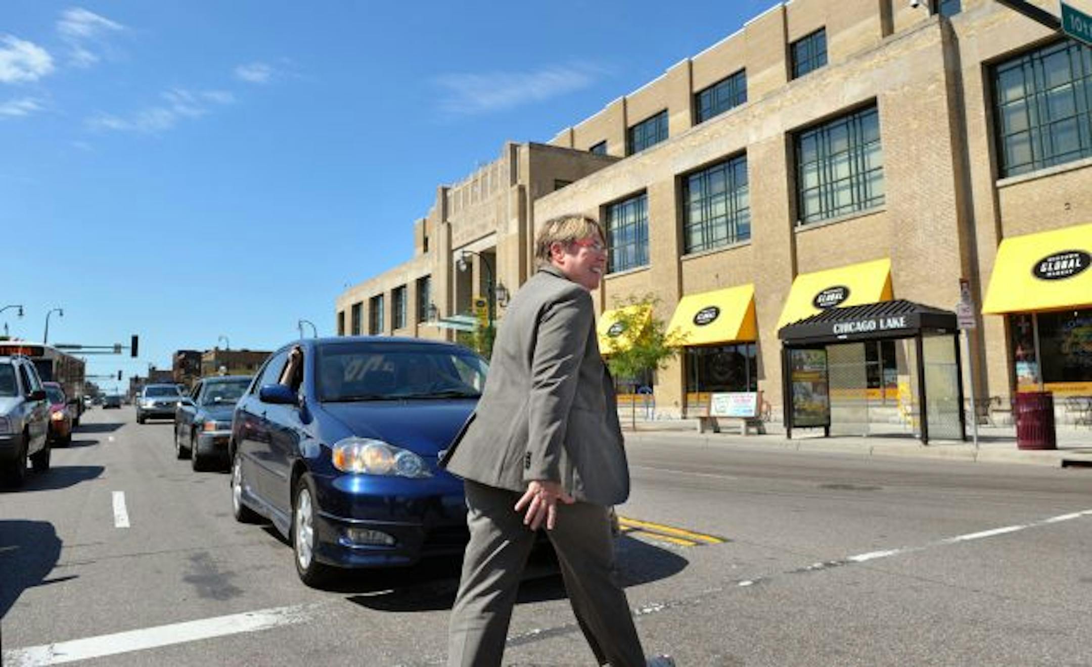 Joyce Wisdom, Lake Street Council executive director, crossed Lake Street from her office in the U. S. Bank to the Midtown Global Market for lunch and to visit with shop owners. Wisdom said Lake Street's image as a sometimes seedy strip is outdated.