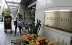 In this Wednesday, Sept. 13, 2017, photo, shoppers come and go from Nordstrom's flagship store in downtown Seattle. Nordstrom says it&#x2019;s tempora