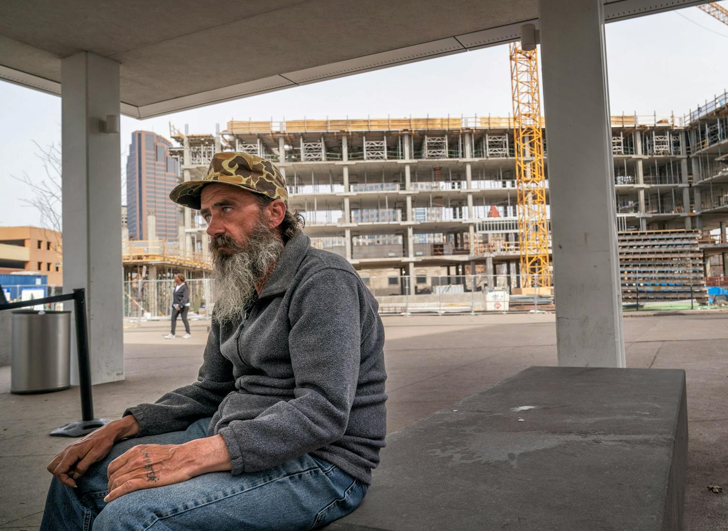 William Carlson waited outside Catholic Charities on Wednesday for the shelter to open. Catholic Charities of St. Paul and Minneapolis is dropping its refugee resettlement and adoption programs.