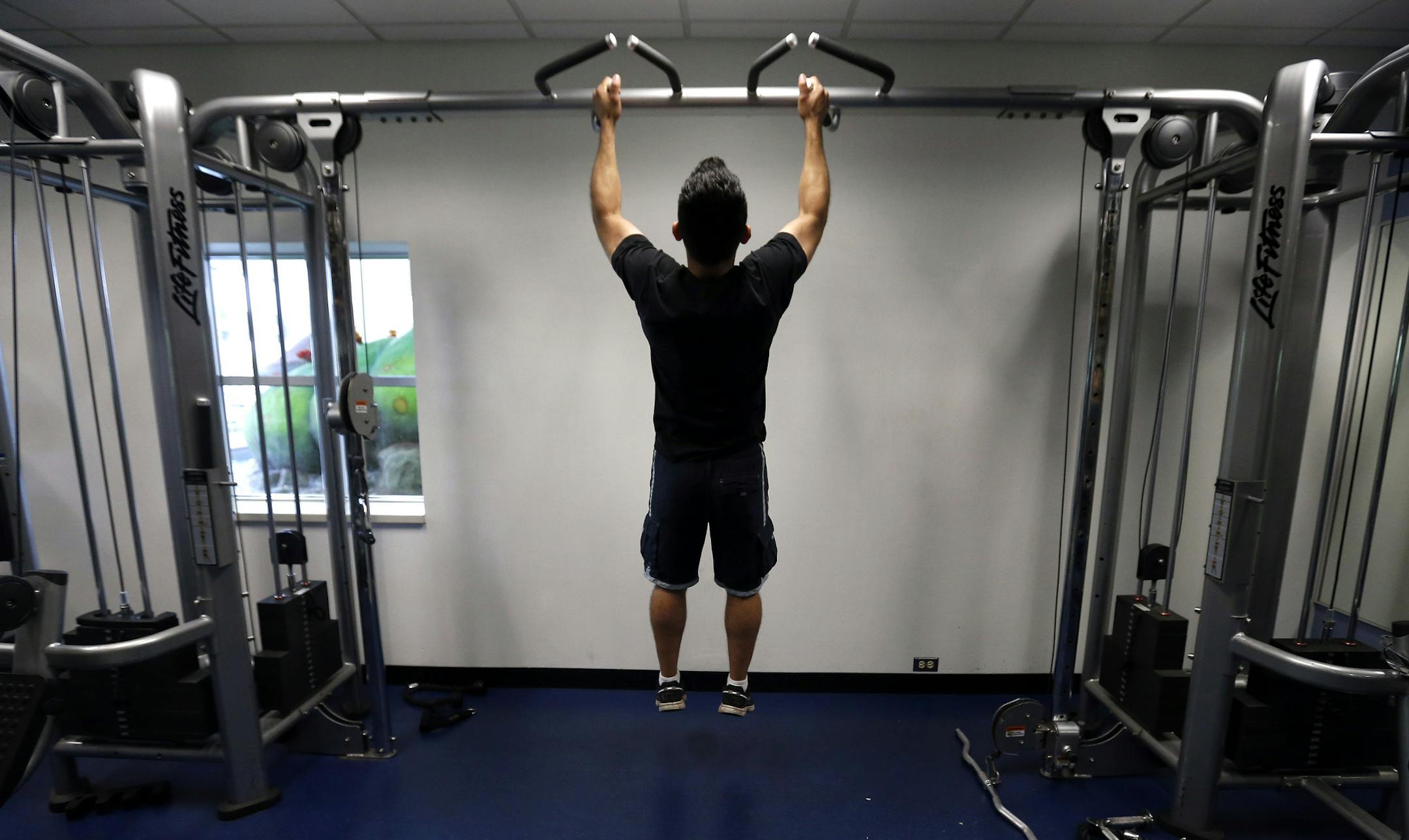 Fares Garcia, 23, worked out at the Chaska Community Center on Thursday. ] CARLOS GONZALEZ cgonzalez@startribune.com August 22, 2013, Chaska, Minn., Chaska Community Center
