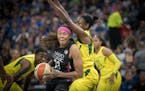 Lynx guard Seimone Augustus drove by Seattle's Jewell Loyd last August