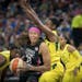 Lynx guard Seimone Augustus drove by Seattle's Jewell Loyd last August