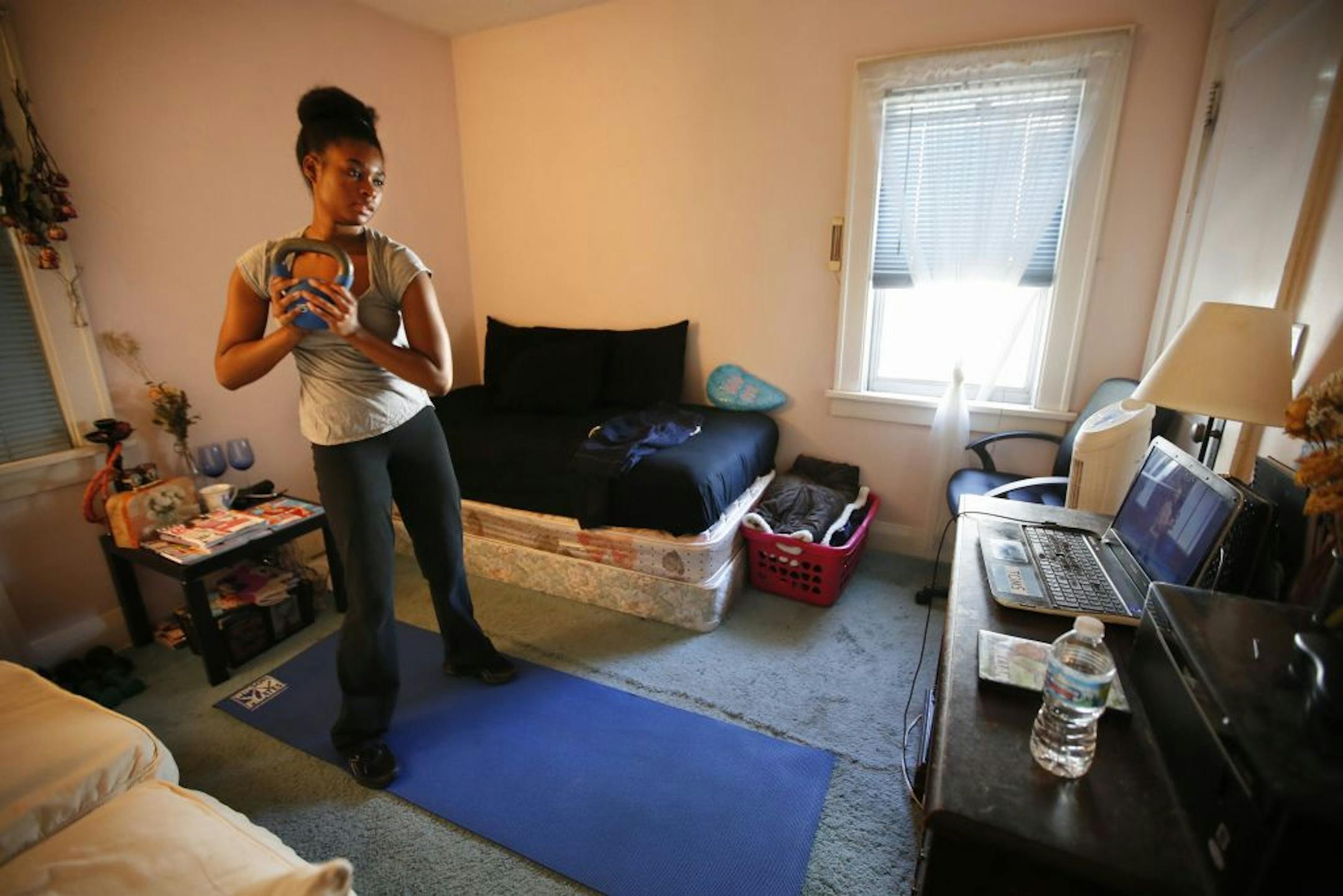 With only a part-time job almost a year after she graduated from the University of St. Thomas, Angelica Carol can't afford her own place.