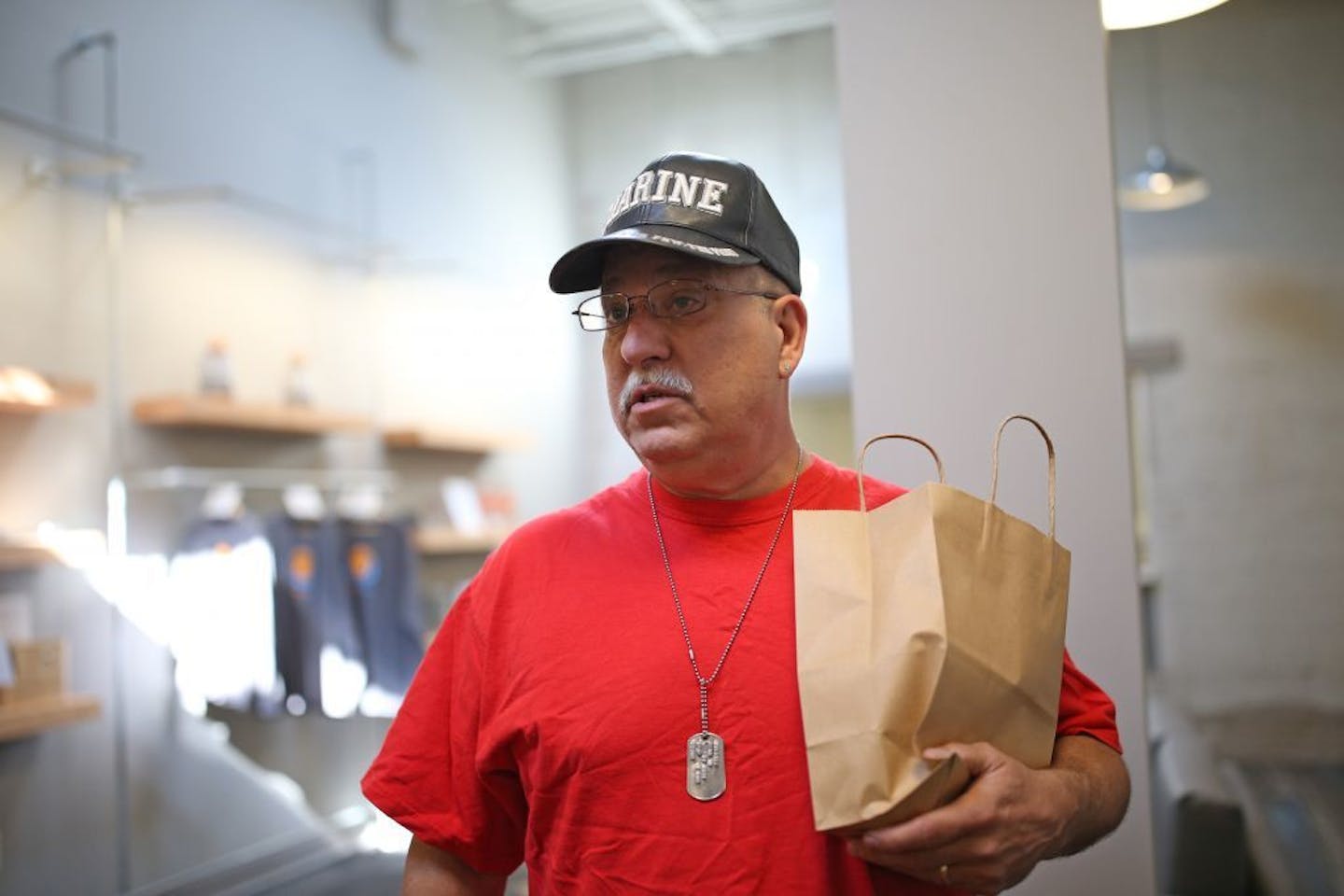 Marine Corps veteran Ed Erdos picked up his prescription of medical marijuana that he uses to treat his chronic pain from Leafline Labs on May 4 in St. Paul.