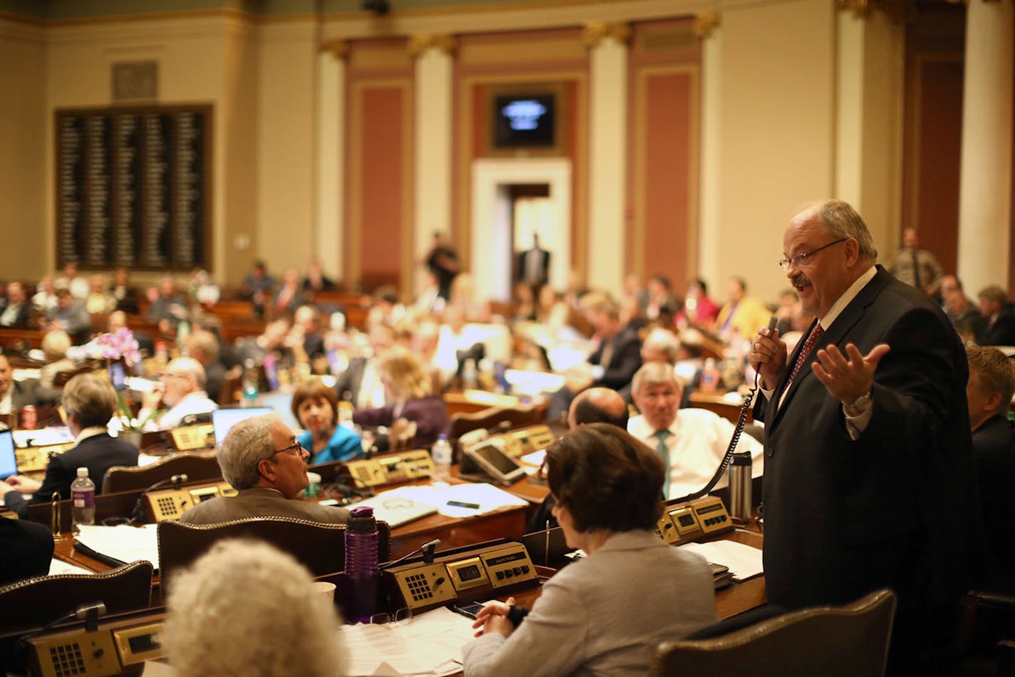 As part of a larger tax measure, legislators gave smokers a tax break. Now it's up to Gov. Mark Dayton to decide whether to veto it. In this photo, Rep. Greg Davids speaks in the House chamber.