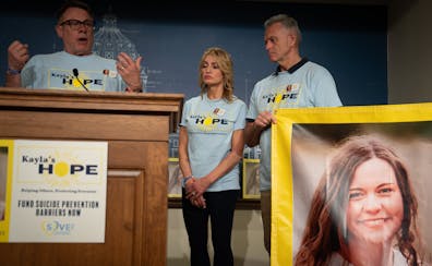 MJ Weiss and her fiancé Dale Blair listen as Erich Mische of Suicide Awareness Voices of Education speaks at a State Capitol news conference last mon