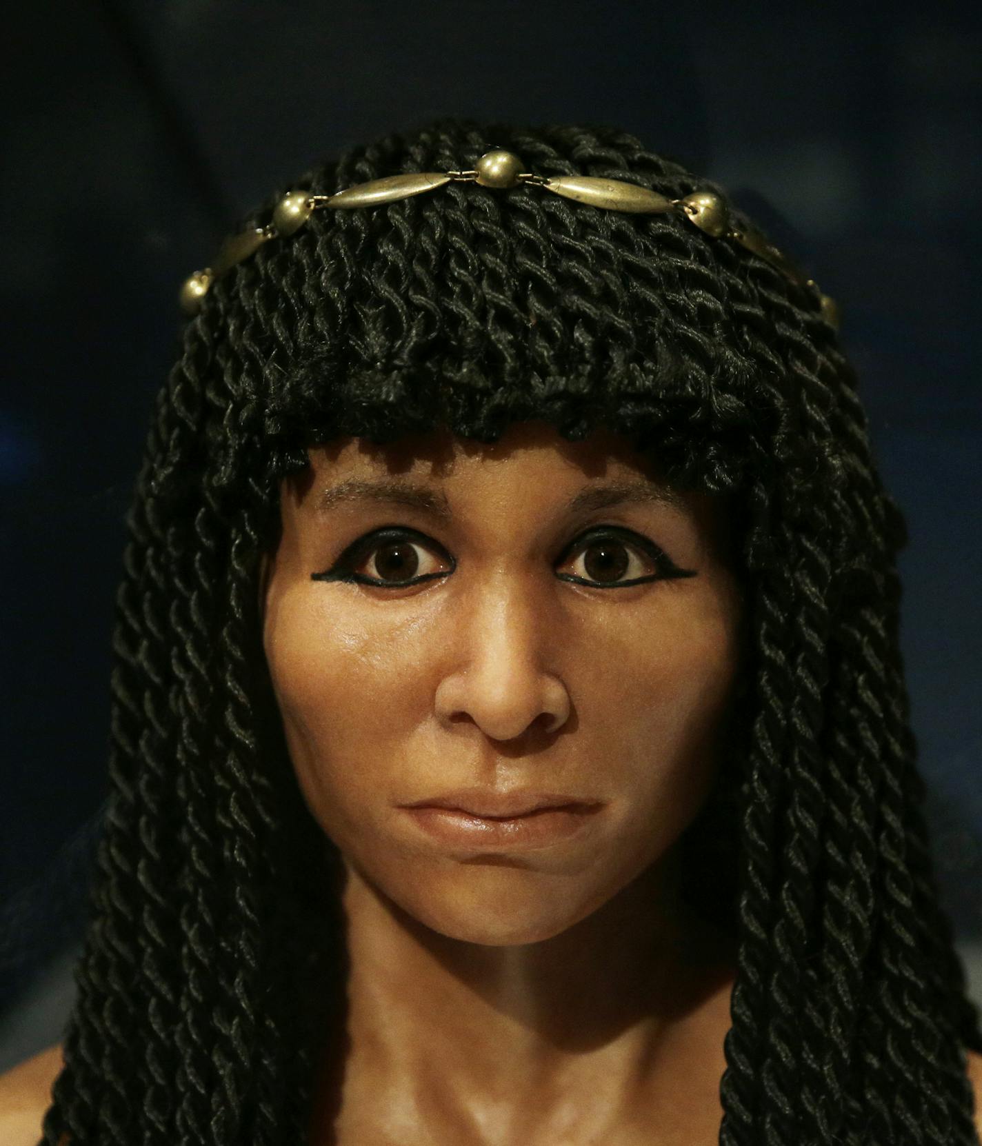 The reconstructed face of an Egyptian mummy known as the Gilded Lady is on display at Natural History Museum, Thursday, Sept. 10, 2015, in Los Angeles. There will be a rare chance to find out when "Mummies: New Secrets From the Tombs" opens Sept. 18 at the museum. (AP Photo/Jae C. Hong)