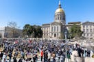 Demonstrators gathered at Liberty Plaza, near the Georgia State Capitol in Atlanta, on Saturday, March 20, 2021, to protest the killing of eight peopl