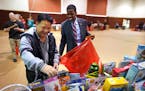 St. Paul Mayor Melvin Carter stopped in at the Salvation Army toy shop in St. Paul on Monday, Dec. 23, and helped shopper John Yang pick out toys for 