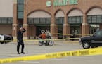 A suspect was in custody after two people were reportedly shot at a Dollar Tree in a Burnsville shopping center over the noon hour Monday.