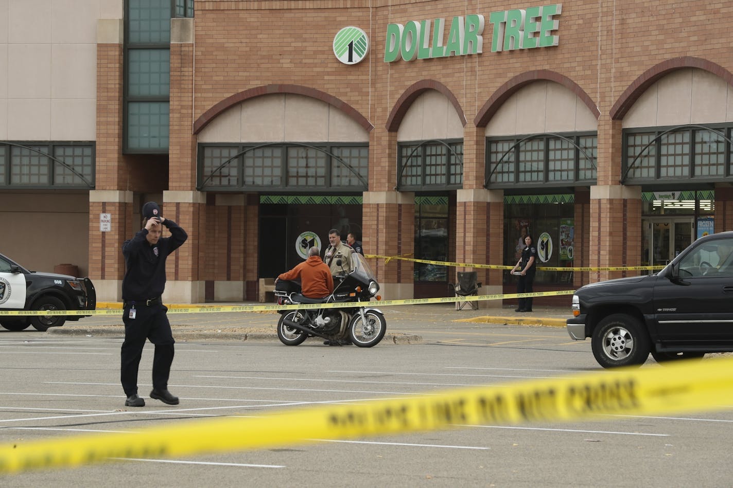 A suspect was in custody after two people were reportedly shot at a Dollar Tree in a Burnsville shopping center over the noon hour Monday.