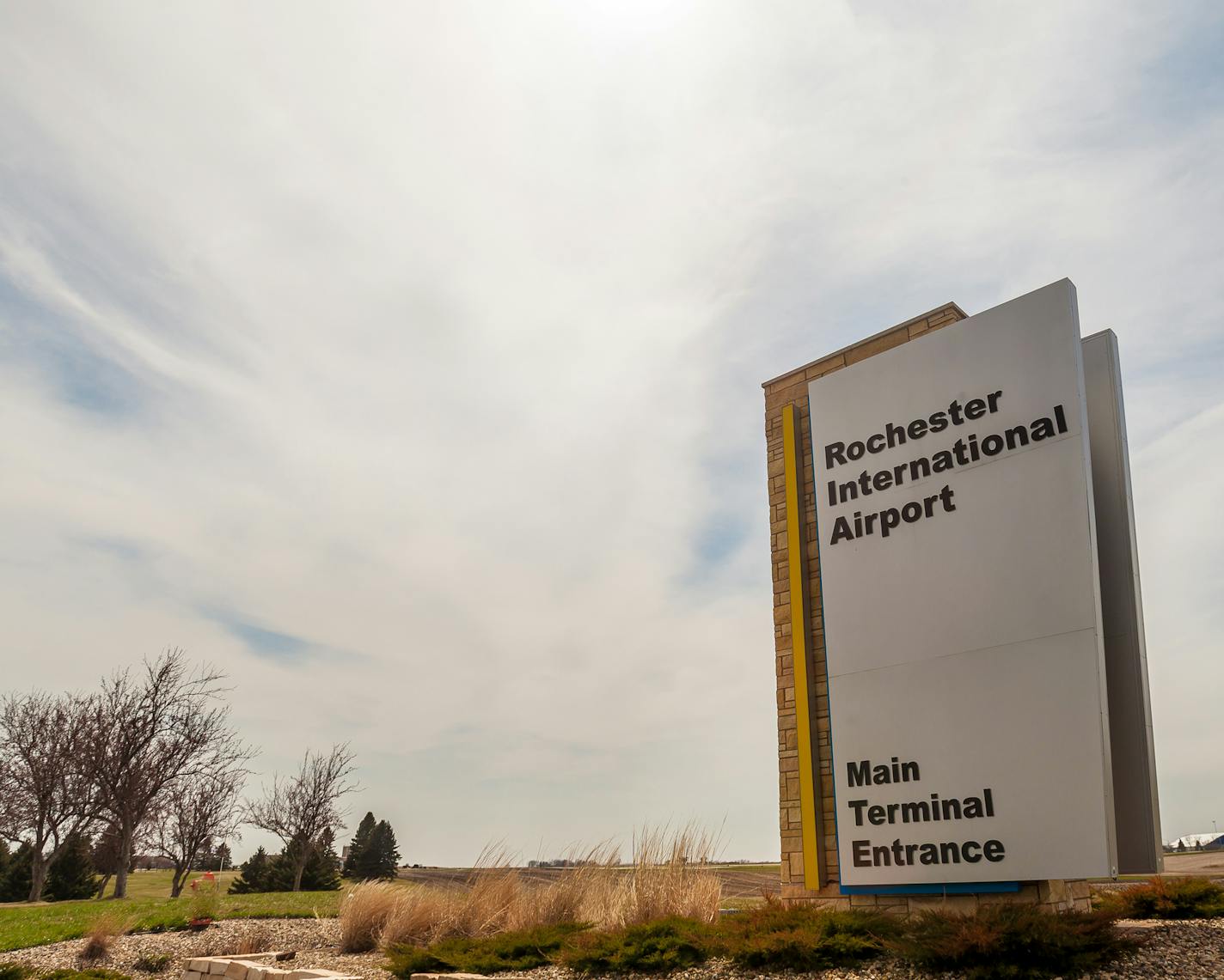 A sign out front signals the main terminal entrance to the Rochester International Airport.