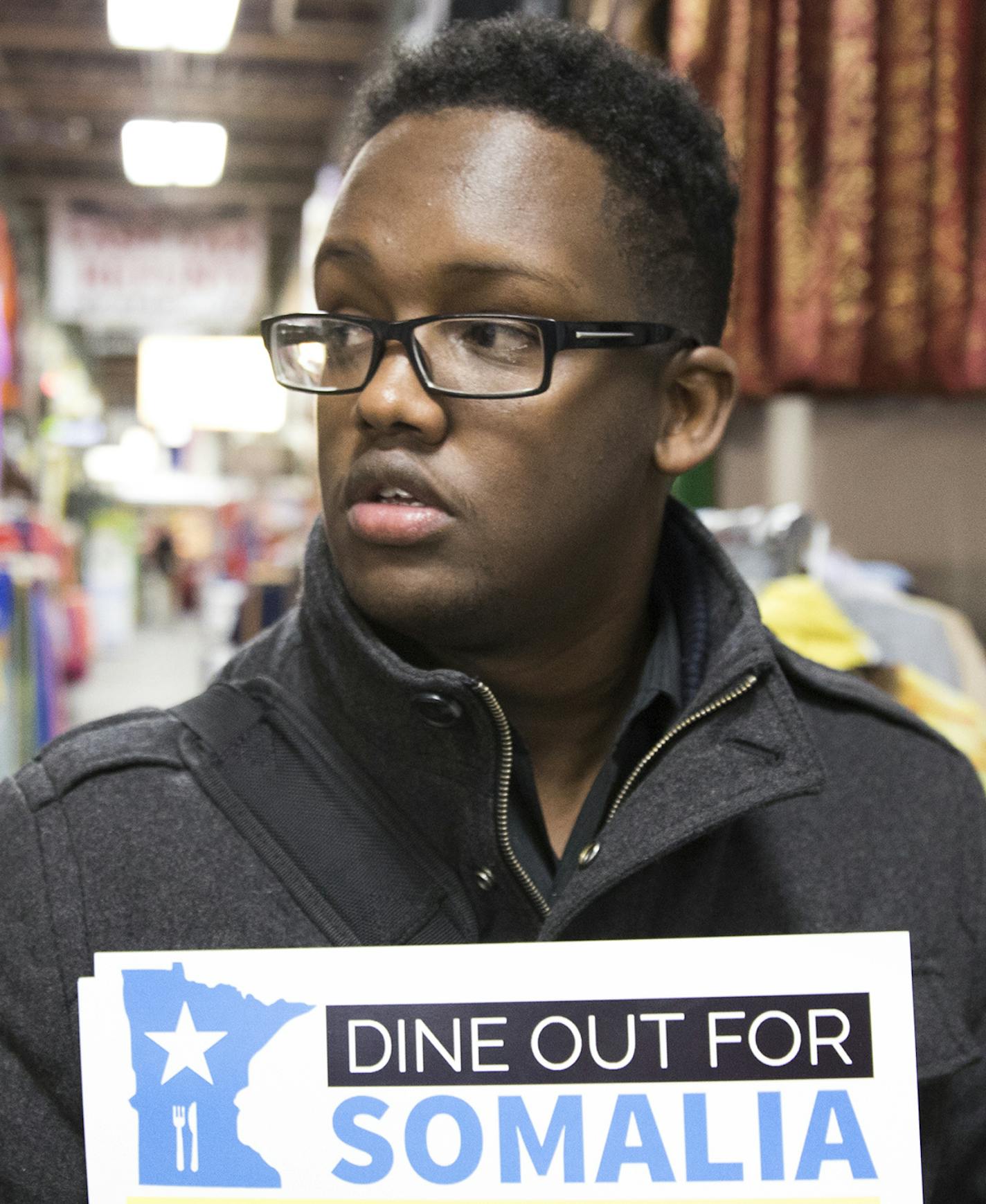 Khalid Mohamed hands out flyers and raises awareness for Dine Out for Somalia at the Village Market mall in Minneapolis. ] LEILA NAVIDI &#xef; leila.navidi@startribune.com BACKGROUND INFORMATION: Raising awareness about Dine Out for Somalia in Minneapolis on Wednesday, March 29, 2017. Somali-American restaurant owners in Minnesota have decided to raise funds by donating a portion of their sales from April 7 directly to support famine relief efforts. Nearly a million children could starve to deat