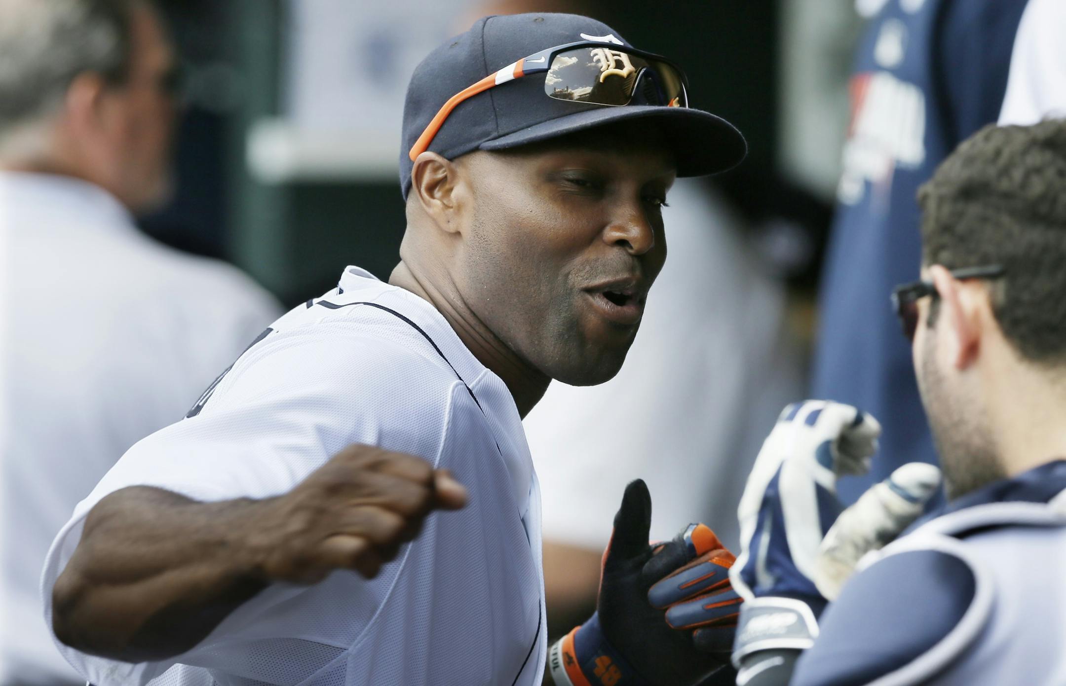 Detroit Tigers right fielder Torii Hunter clowns around in the dugout with catcher Alex Avila before the first inning of an interleague baseball game against the Pittsburgh Pirates, Thursday, Aug. 14, 2014 in Detroit. (AP Photo/Carlos Osorio) ORG XMIT: otkco116