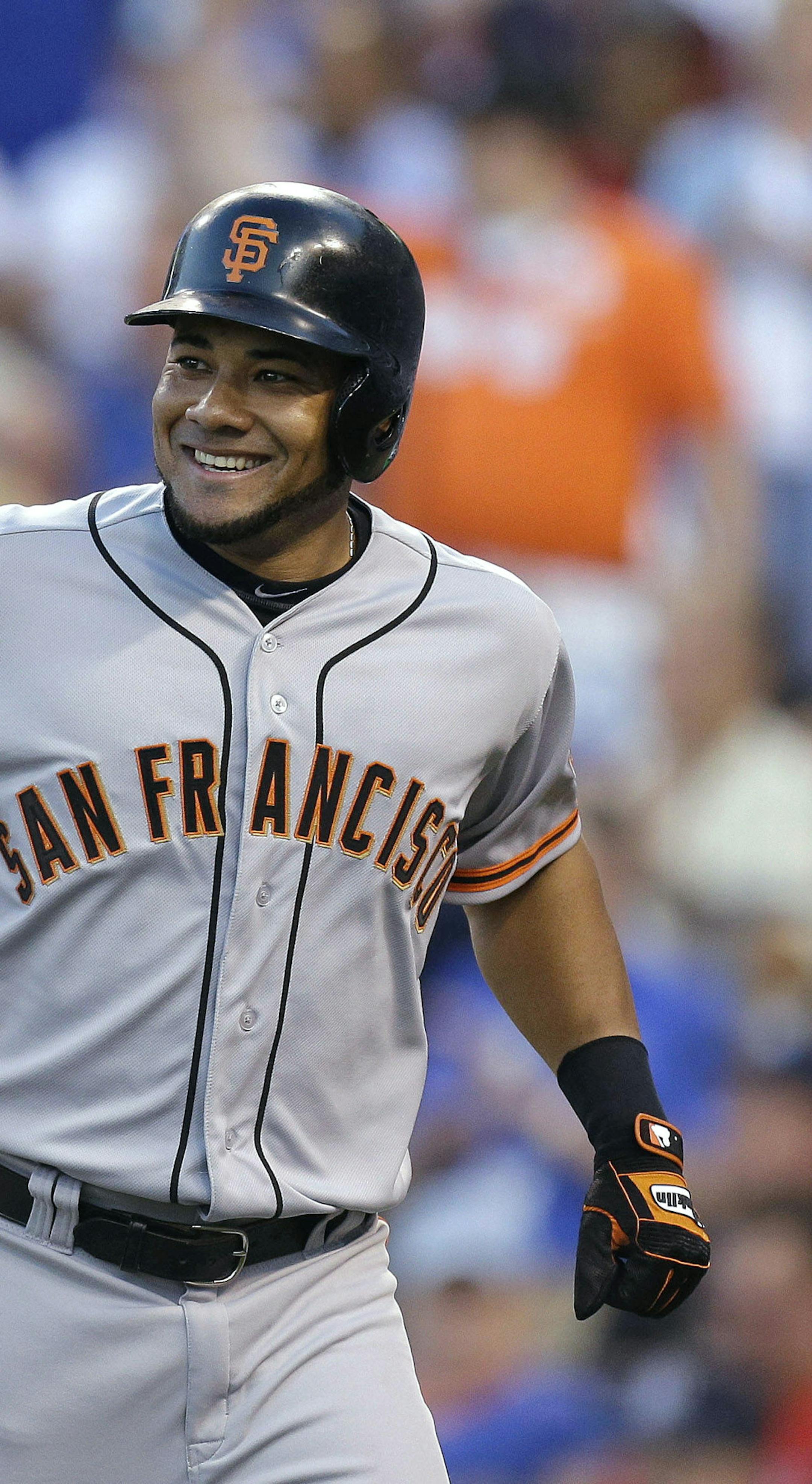 National League's Melky Cabrera, right, of the San Francisco Giants, celebrates his two-run home run with Matt Holliday, of the St. Louis Cardinals, during the fourth inning of the MLB All-Star baseball game, Tuesday, July 10, 2012, in Kansas City, Mo. (AP Photo/Jeff Roberson)