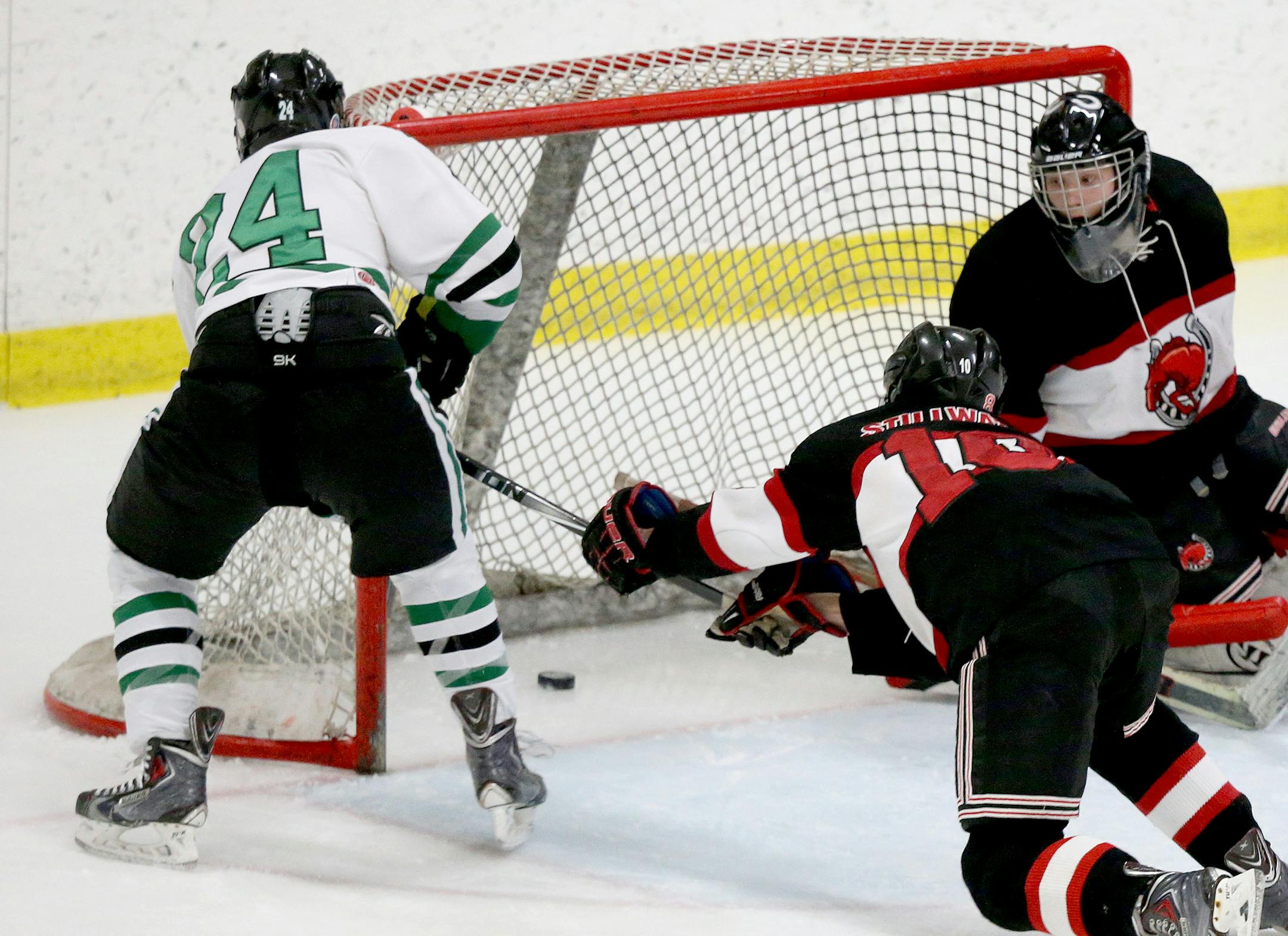 Hill-Murray's Mikey Anderson (24) scores a first period goal past Stillwater goalie Josh Benson (30) in the 2A boys' hockey section final Friday, Feb. 27, 2015, at Aldrich Arena in Maplewood, MN. ](DAVID JOLES/STARTRIBUNE)djoles@startribune.com Class 2A boys' hockey section final, Hill-Murray vs. Stillwater.