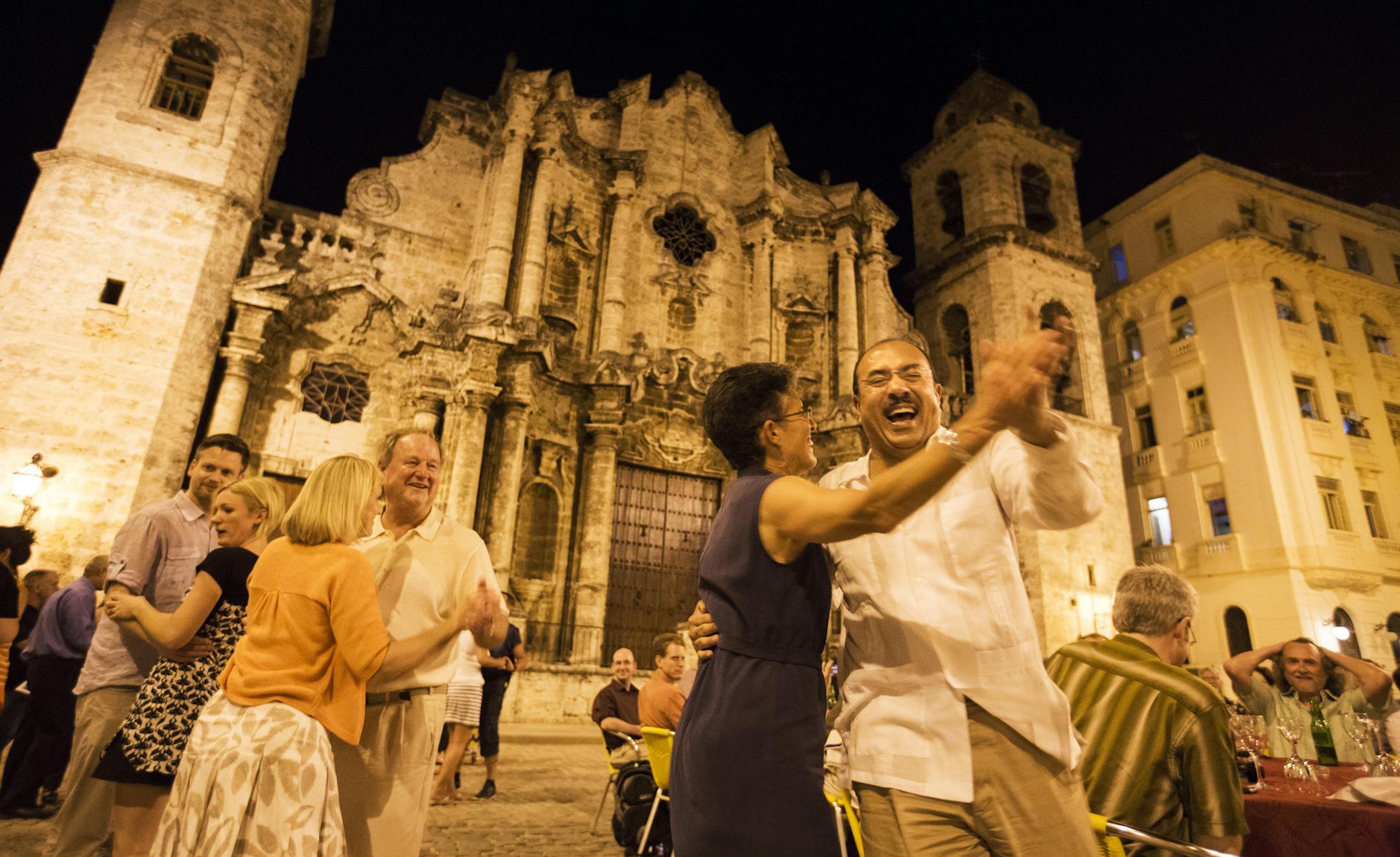 Minnesota Orchestra violin player Deborah Serafini dances with trumpet player Manny Laureano in Plaza de la Catedral in Havana, Cuba on Thursday, May 14, 2015. ] LEILA NAVIDI leila.navidi@startribune.com /