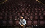 Roger Reinert, the interim executive director of the DECC, posed for a portrait among empty seats in the Symphony Hall on Thursday morning. ] ALEX KOR