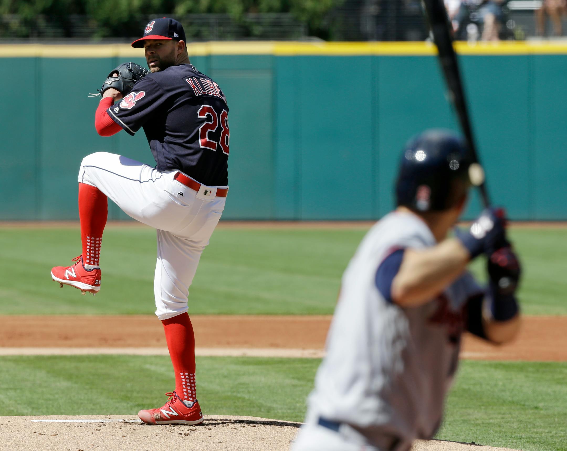 Cleveland Indians starting pitcher Corey Kluber delivers against Minnesota Twins' Brian Dozier in the first inning of a baseball game, Saturday, June 24, 2017, in Cleveland.