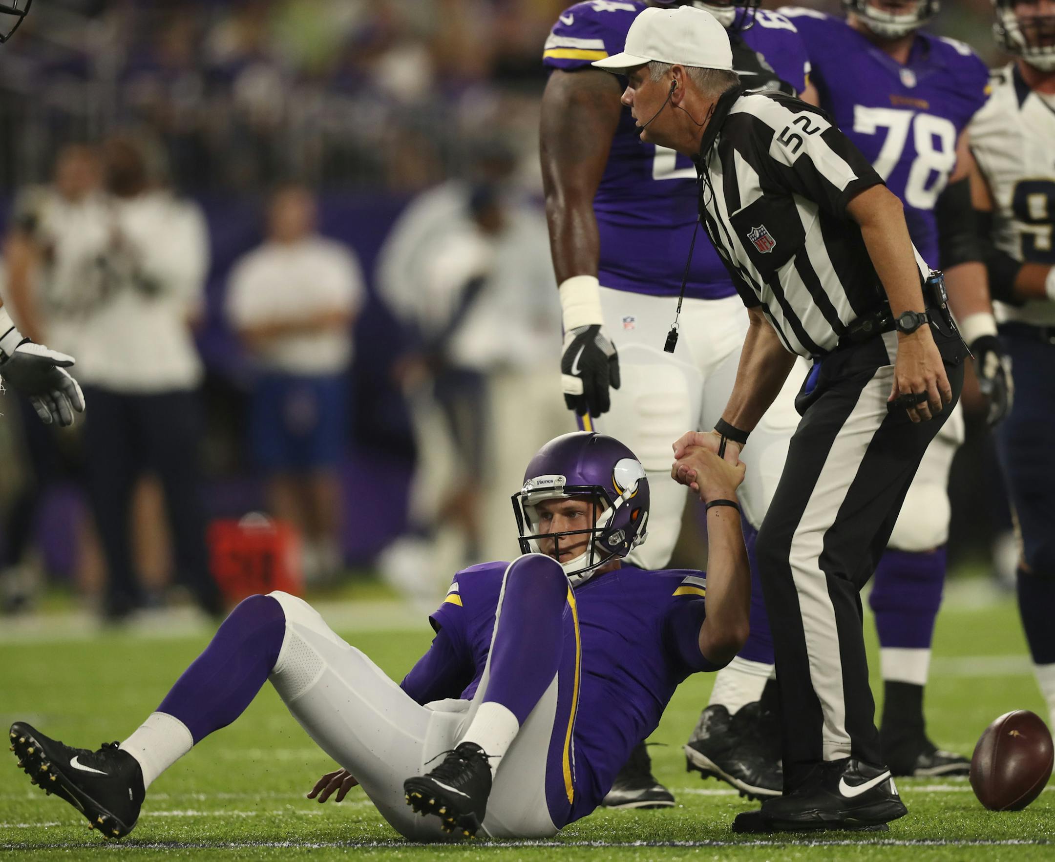 Vikings quarterback Joel Stave (2) was helped to his feet by referee Bill Vinovich after he was sacked for an eight yard loss early in the second quarter. ] JEFF WHEELER ï jeff.wheeler@startribune.com The Minnesota Vikings played the Los Angeles Rams in their final game of the NFL preseason Thursday night, September 1, 2016 at U.S. Bank Stadium in Minneapolis.