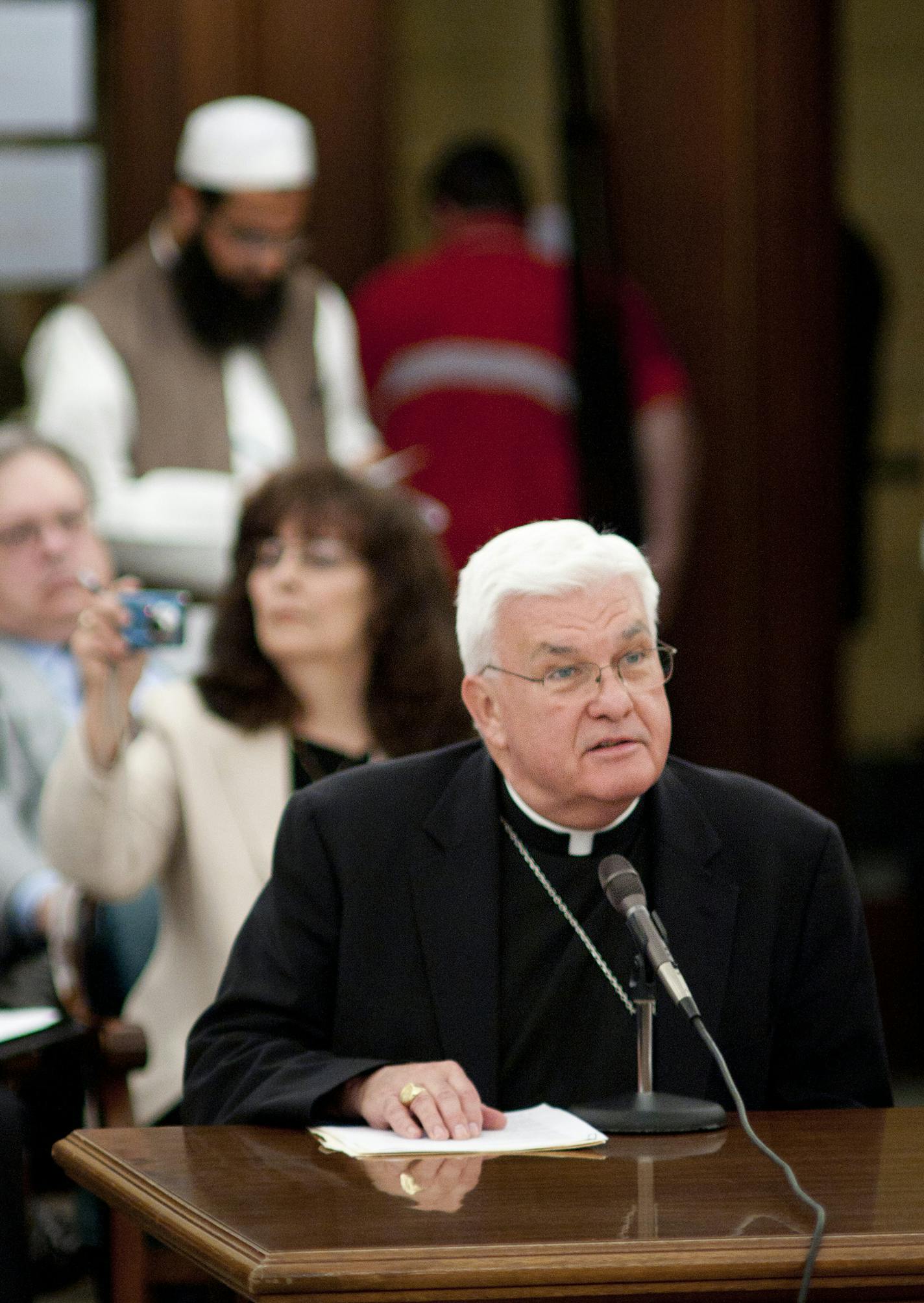 GLEN STUBBE &#x2022; gstubbe@startribune.com -- Friday, April 29, 2011 -- St. Paul, Minn. -- The first day of public testimony before the Senate Judiciary and Public Safety Committee at the State Capitol on a proposed amendment to the state constitution recognizing marriage as only a union between one man and one woman. ] Bishop John Quinn, Diocese of Winona spoke in support of the amendment, behind him is Shaykh Faraz Ahmad, Muslim community Center, Bloomington, who also spoke in support of the