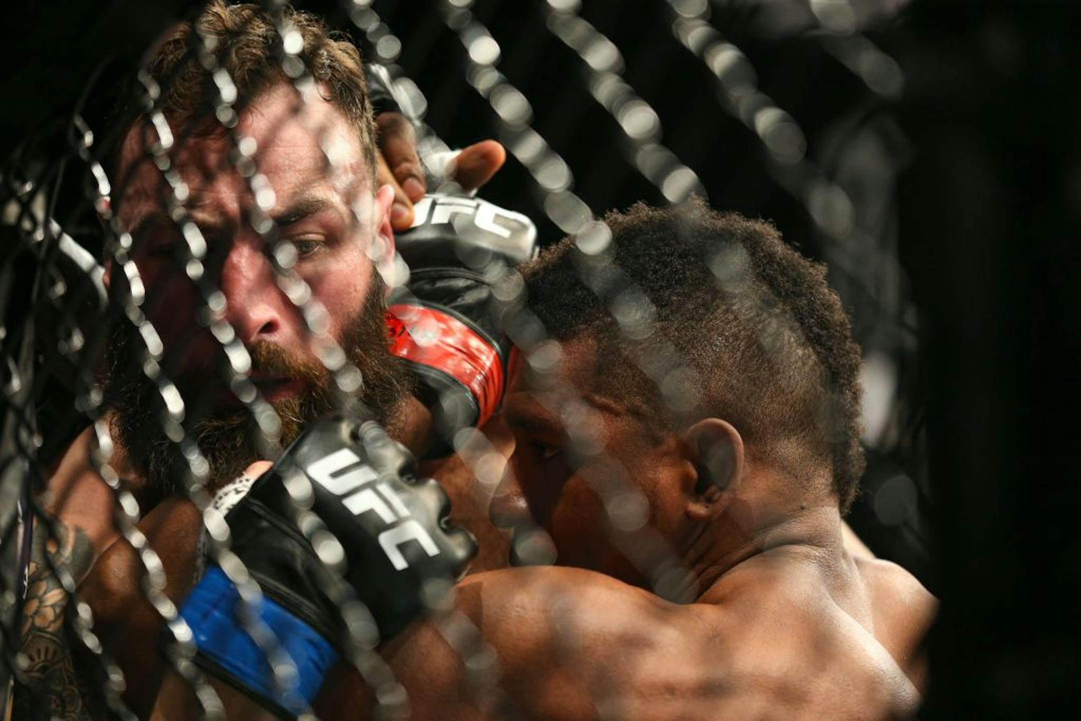 Paul Craig (left) is pinned against the cage by Alonzo Menifield in the first round of their fight. Menifield would go on to win by first round KO. ALEX KORMANN ¥ alex.kormann@startribune.com UFC Fight Night was held at Target Center on Saturday June 29, 2019. Francis Ngannou and Junior Dos Santos headlined the event.